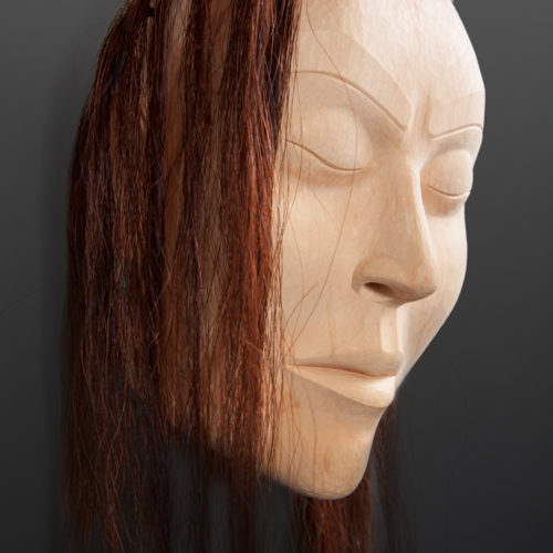Woman Portrait Mask Raymond SHaw Kwakwaka'wakw Yellow cedar, horse hair, abalone 11" x10" x 5" 31" with hair $3000