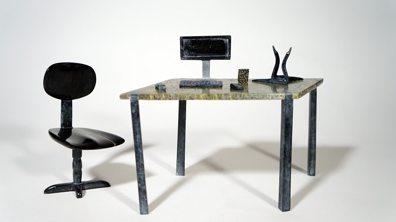 "The Buyer's Desk at the Co-Op" Miniature Ningeosiak Ashoona Inuit serpentine 6 ½” X 5 ½” X 3” $1550